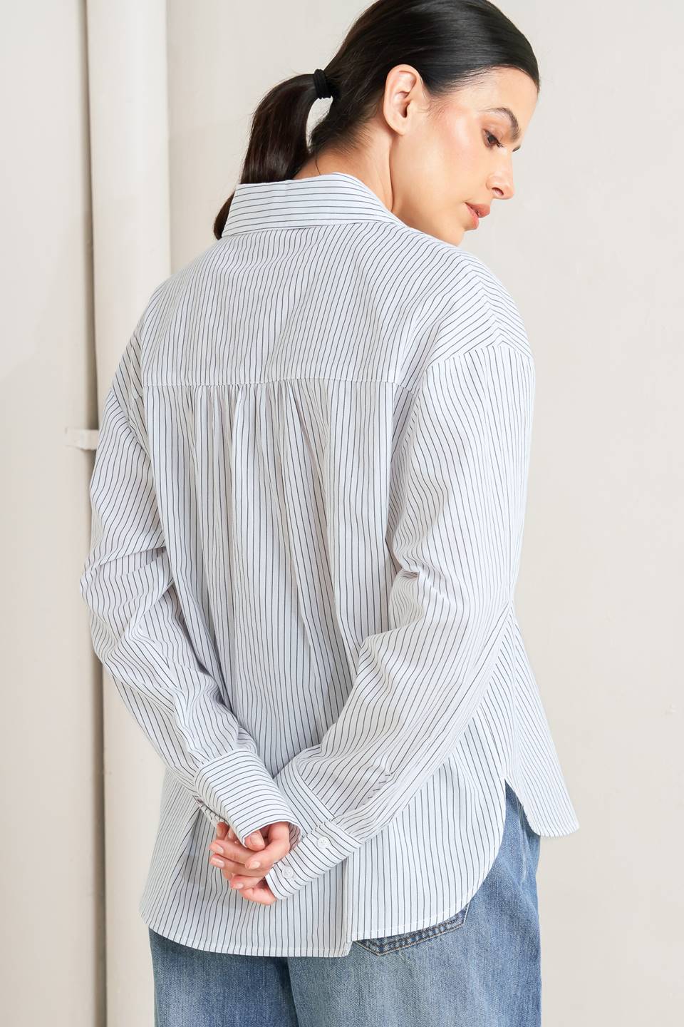 DAYLIGHT EDGE WOVEN RUFFLE DETAIL LONG SLEEVE TOP. Website exclusive · Ships direct!