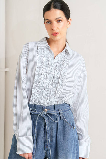 DAYLIGHT EDGE WOVEN RUFFLE DETAIL LONG SLEEVE TOP. Website exclusive · Ships direct!